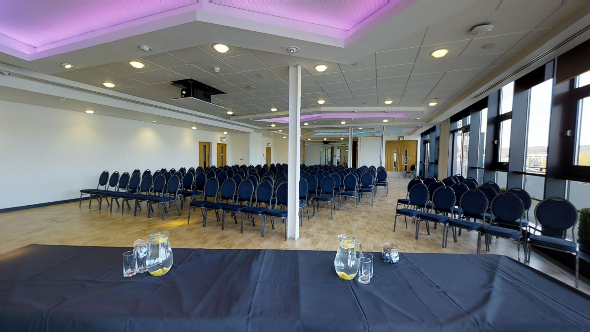 Spacious M Shed Events Suite set for a conference with modern design and natural light.