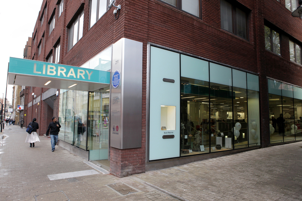Modern library meeting room with large windows for community events and workshops.