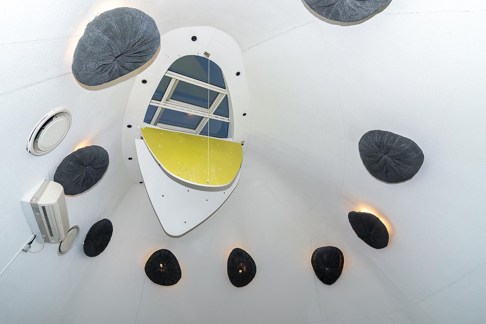 Modern meeting space in Peckham Library with circular ceiling and natural light.