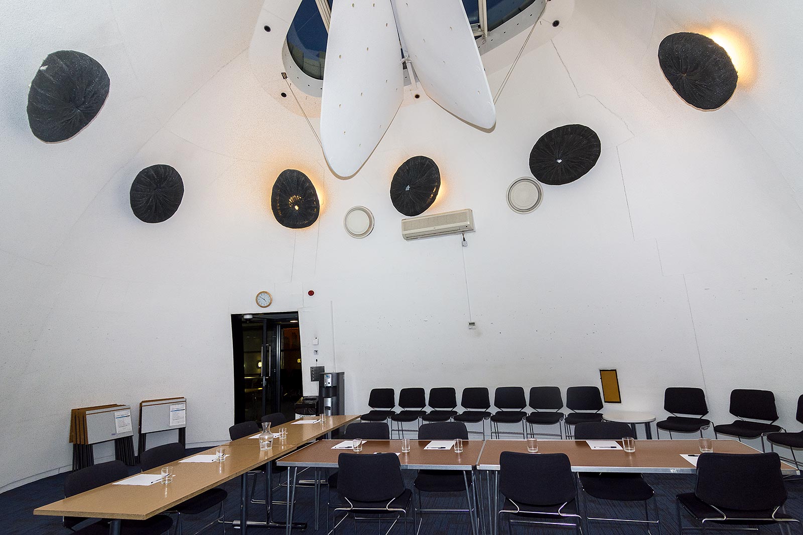 Modern meeting space in Peckham Library with high ceiling, ideal for workshops.