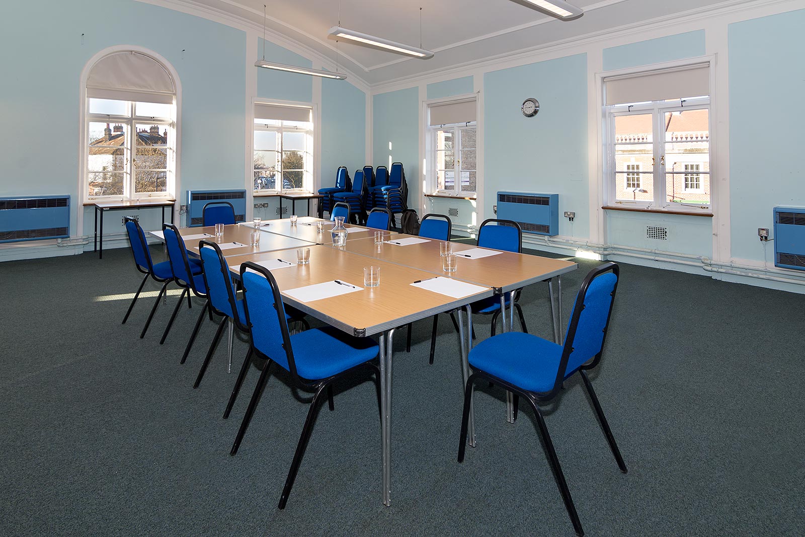 Dulwich Library Hall meeting room with blue chairs, ideal for workshops and presentations.