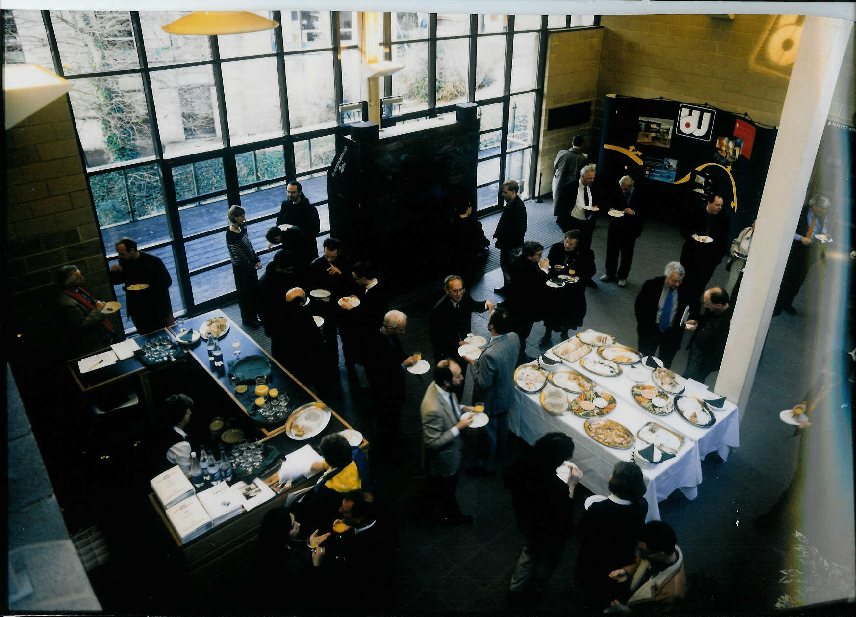 Networking event in Beaulieu Lecture Theatre with attendees enjoying refreshments.