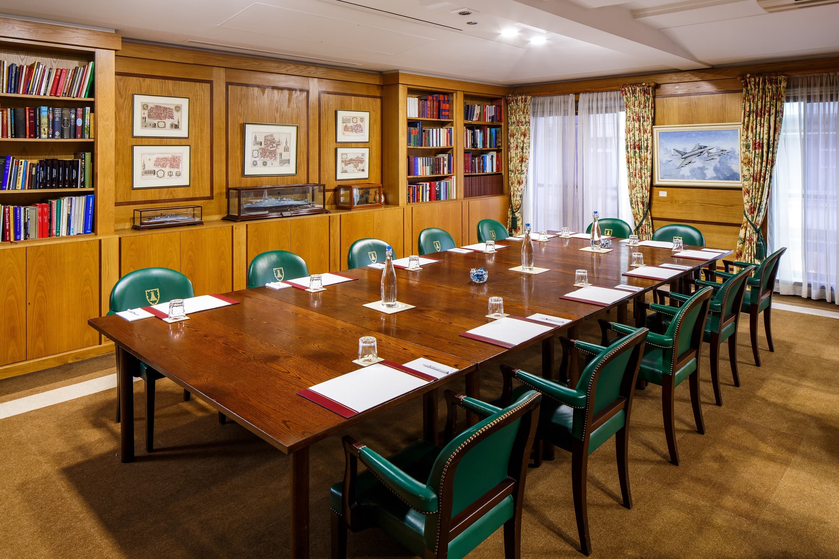 Wood-paneled library boardroom at Mercers' Hall for executive meetings and strategy retreats.
