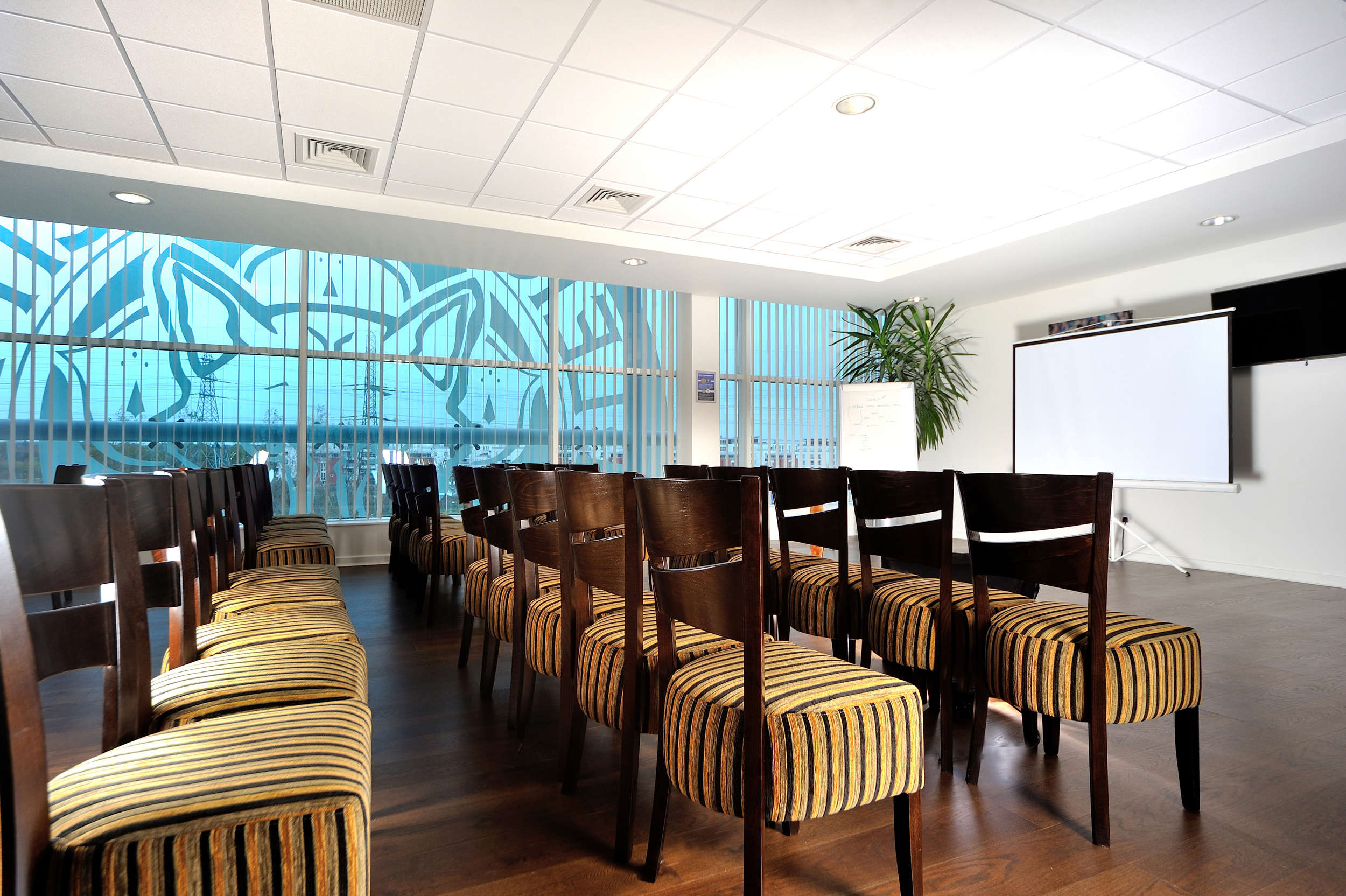 Rowley Suite at Leicester City FC: stylish meeting room for workshops with large screen.