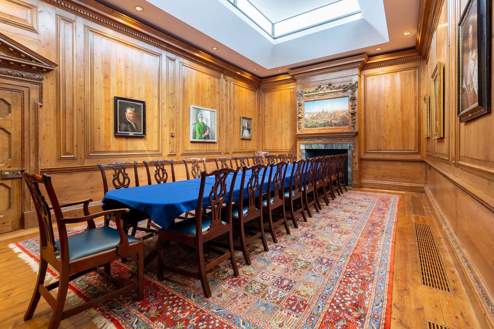 Luncheon Room at Haberdashers' Hall with wooden paneling, ideal for formal meetings.
