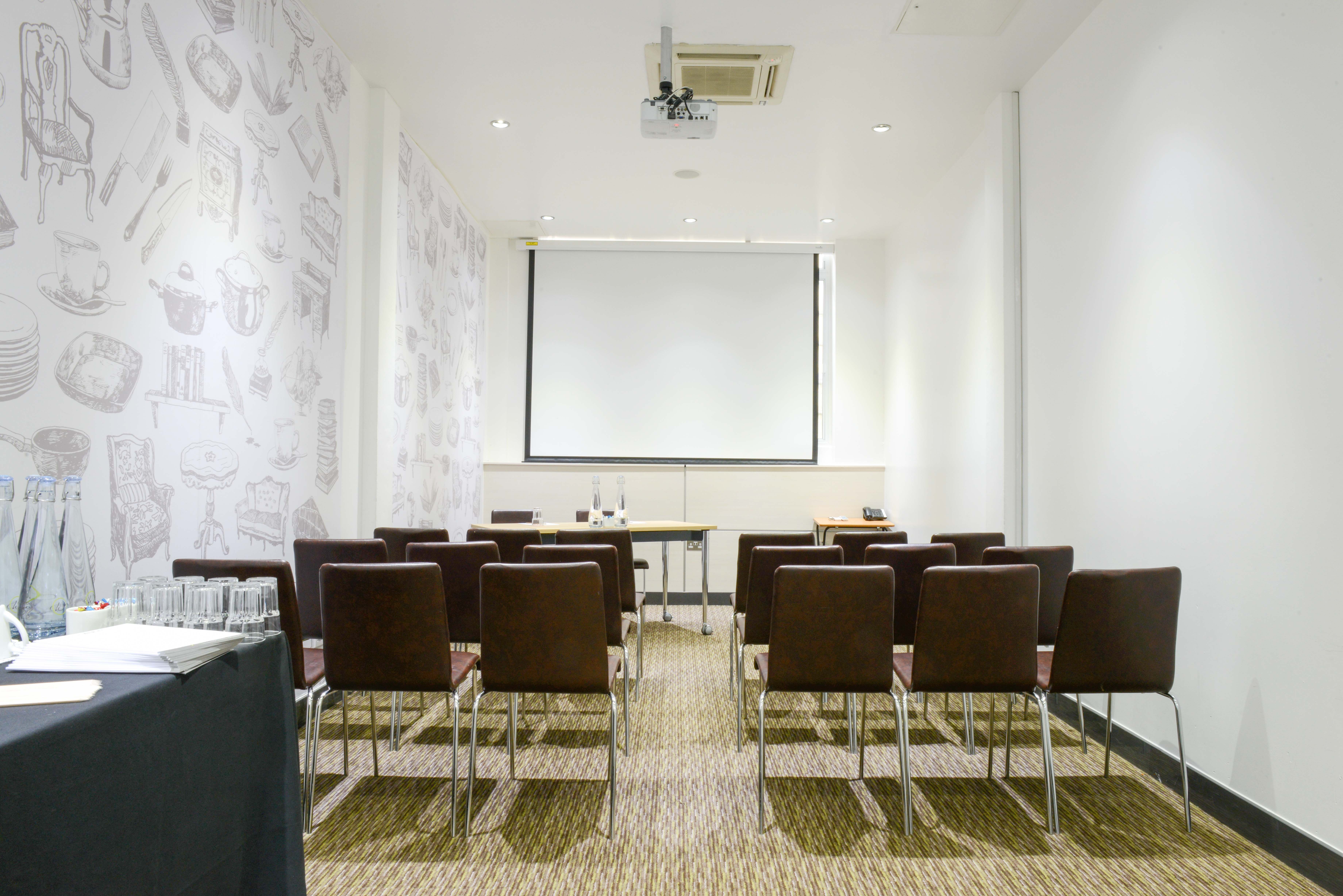 Modern meeting room in The Wesley Euston Hotel, perfect for presentations and workshops.