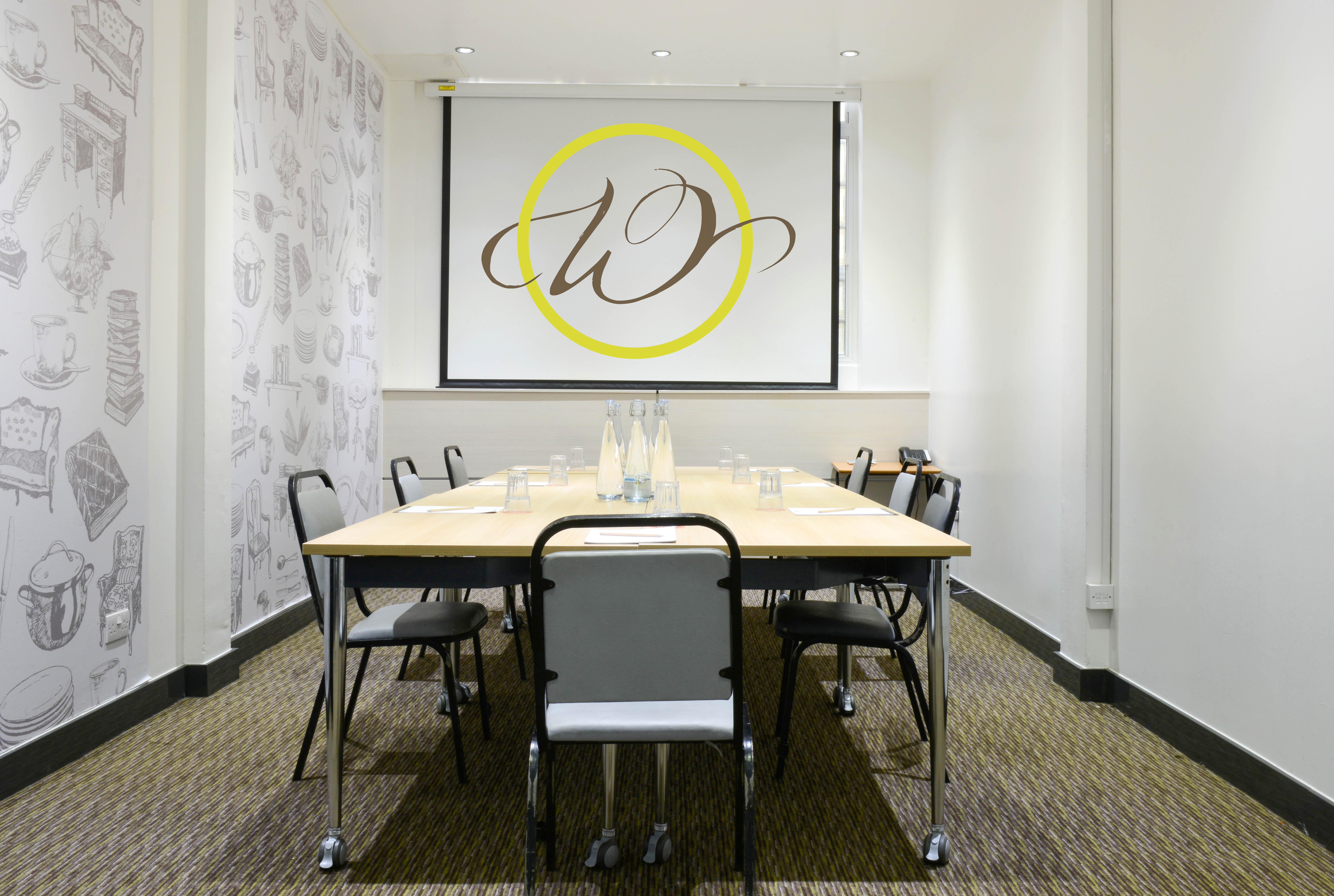Modern meeting room in The Wesley Euston Hotel, ideal for corporate workshops and presentations.