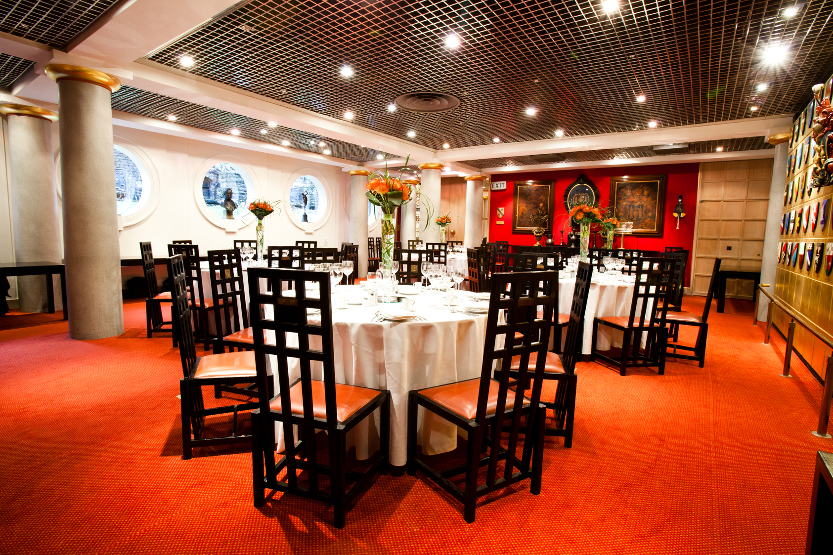 Elegant Livery Hall event space with round tables, perfect for corporate meetings or upscale dinners.