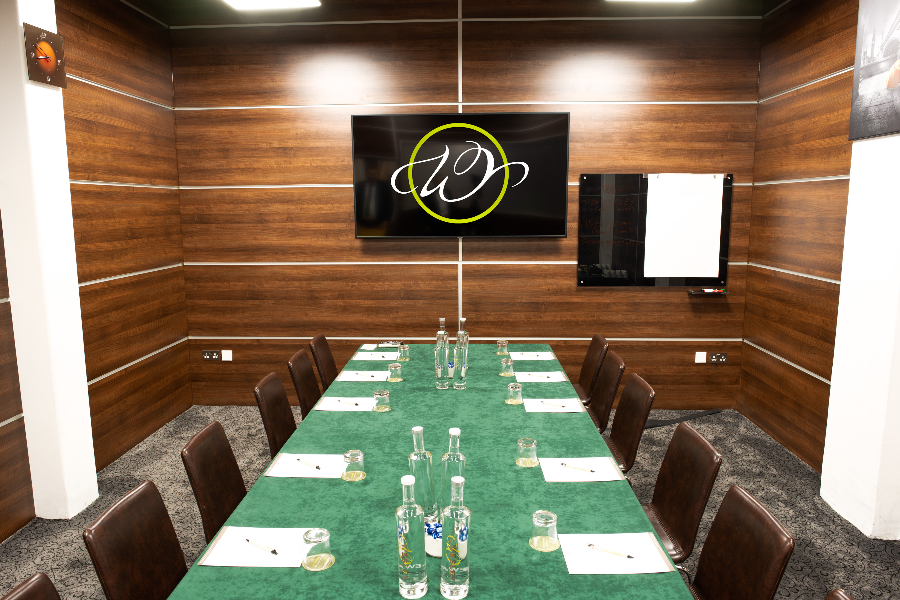 Meeting room at The Wesley Euston Hotel with wooden paneling for professional events.