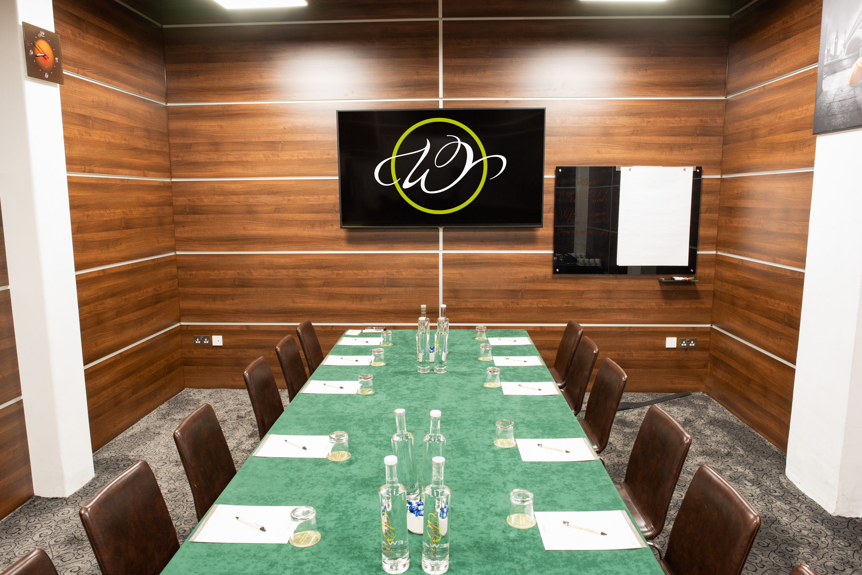 Meeting room at Wesley Euston Hotel, featuring wood paneling for conferences and events.