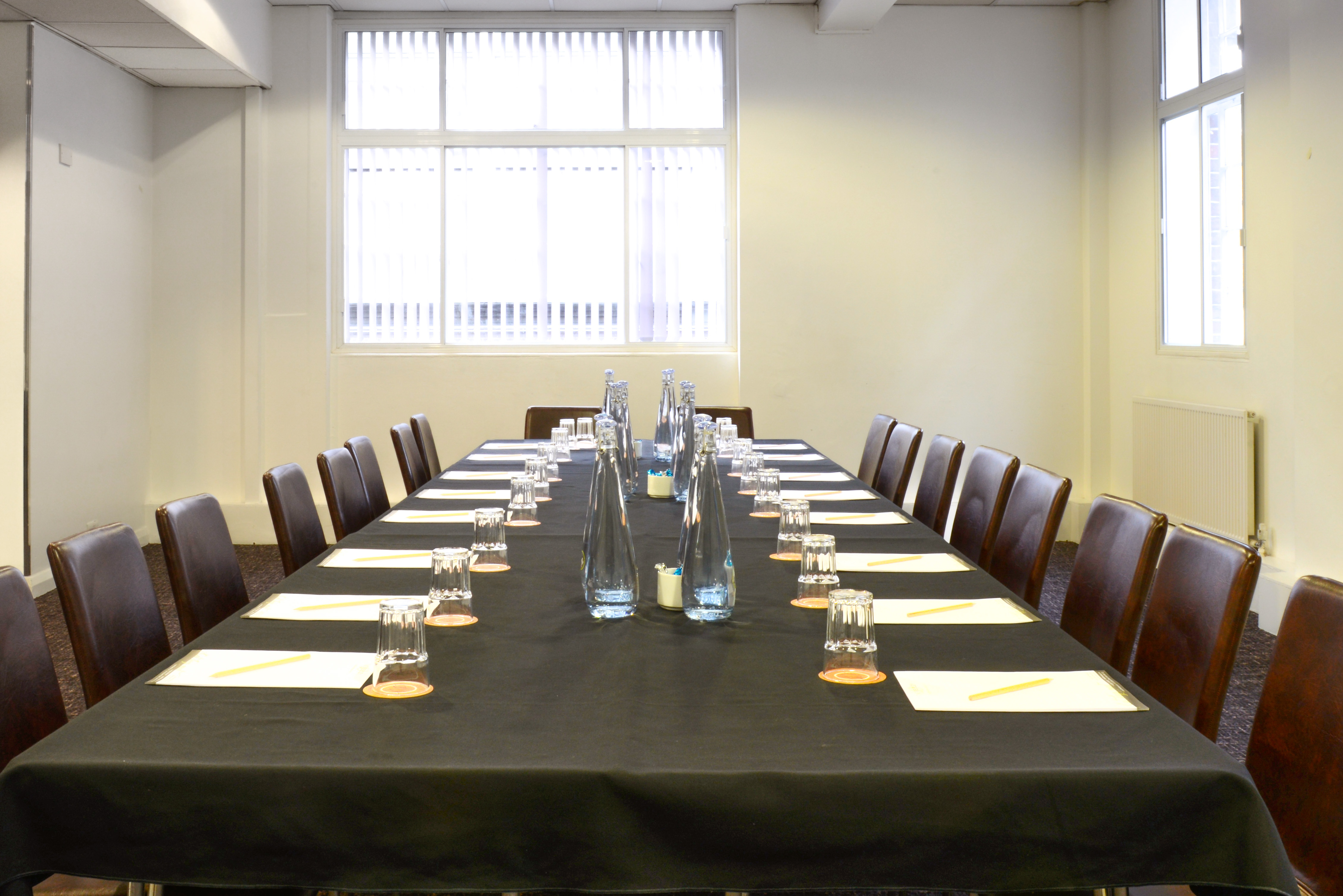 Meeting room at Wesley Euston Hotel, set for professional discussions and workshops.
