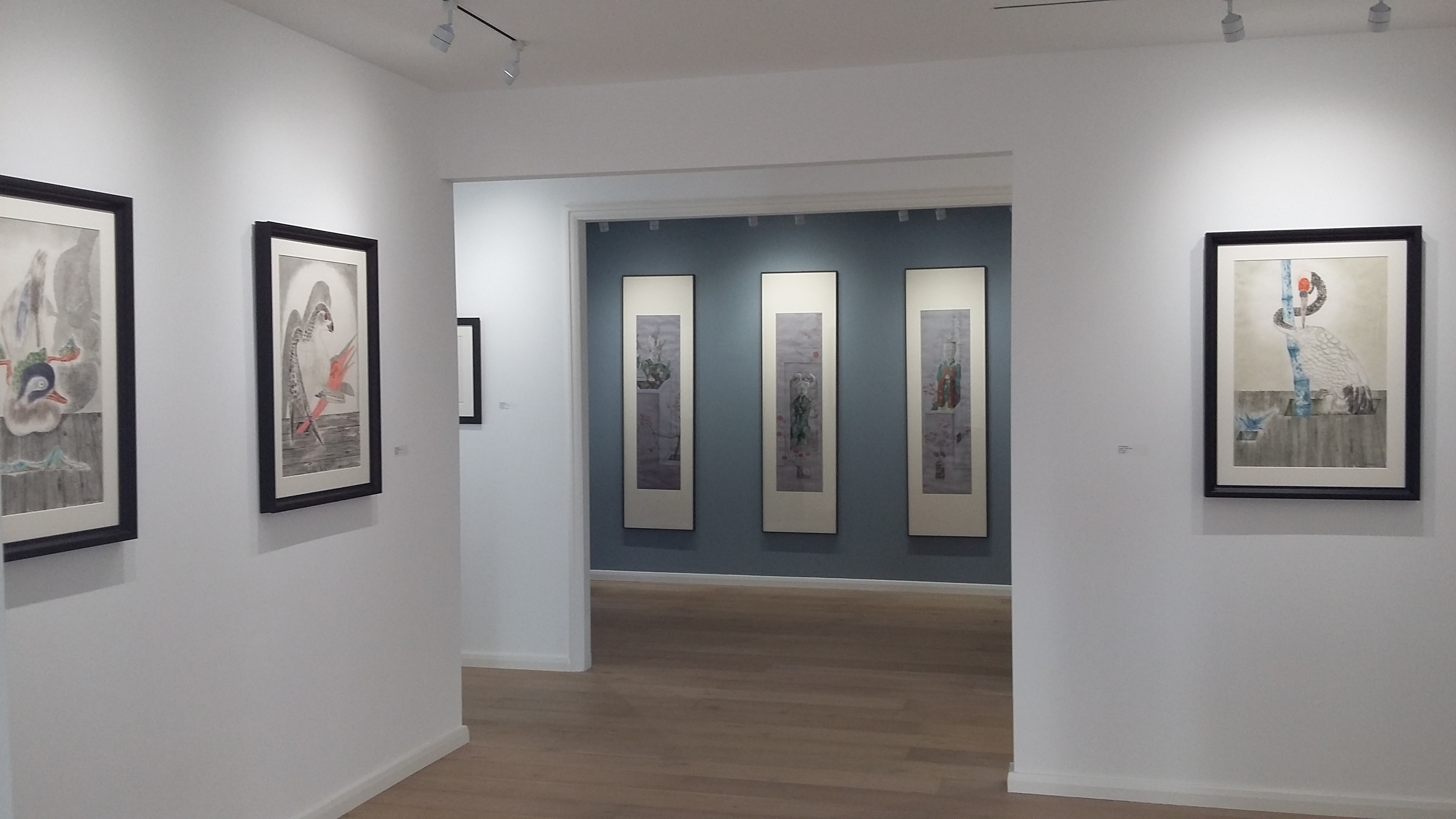 Event Space in Arthill Gallery with framed artworks, ideal for networking and exhibitions.
