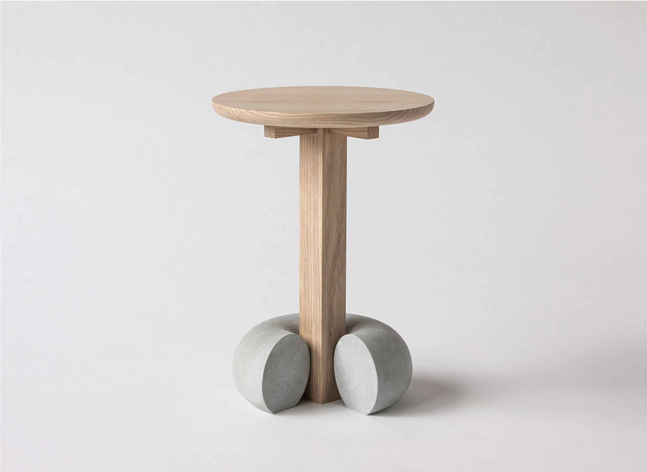 Modern wooden table with concrete bases in Arthill Gallery event space for networking.