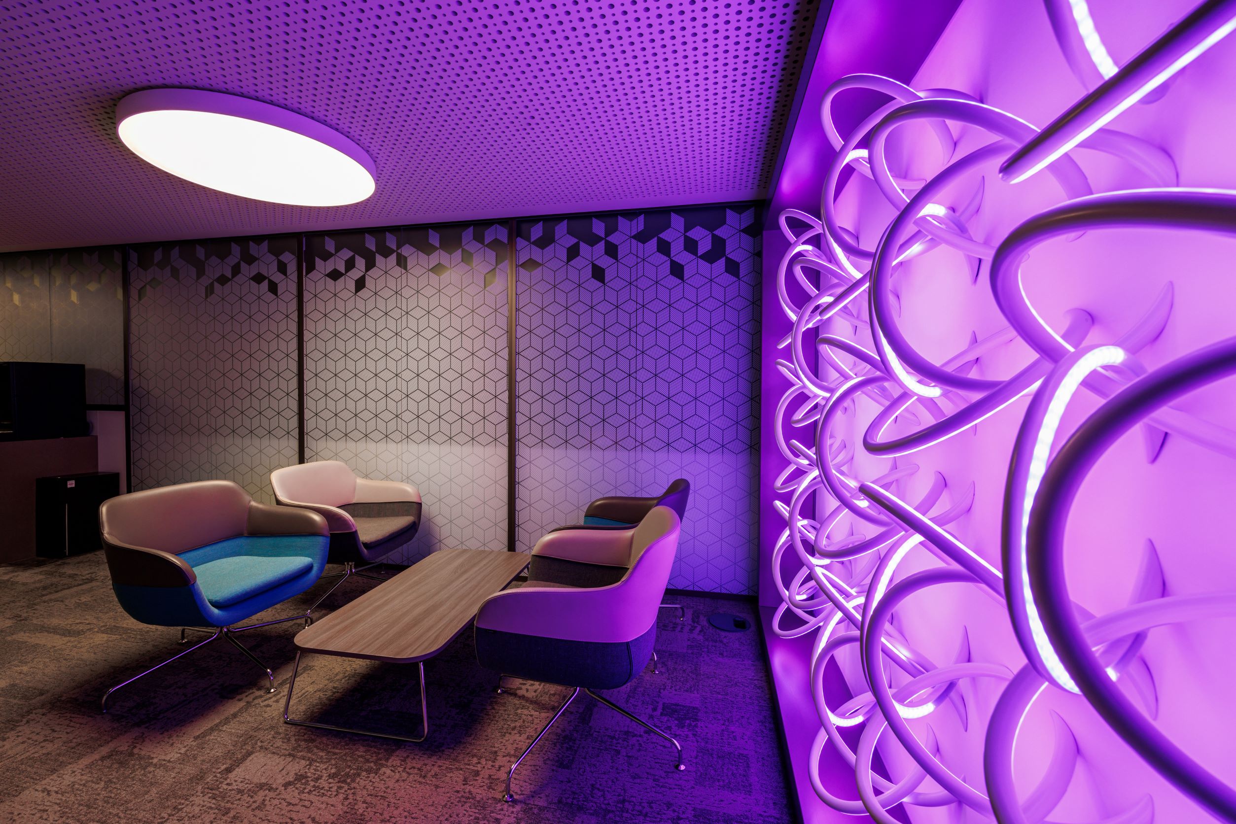 Modern meeting space with sleek furniture at One Moorgate Place for creative events.