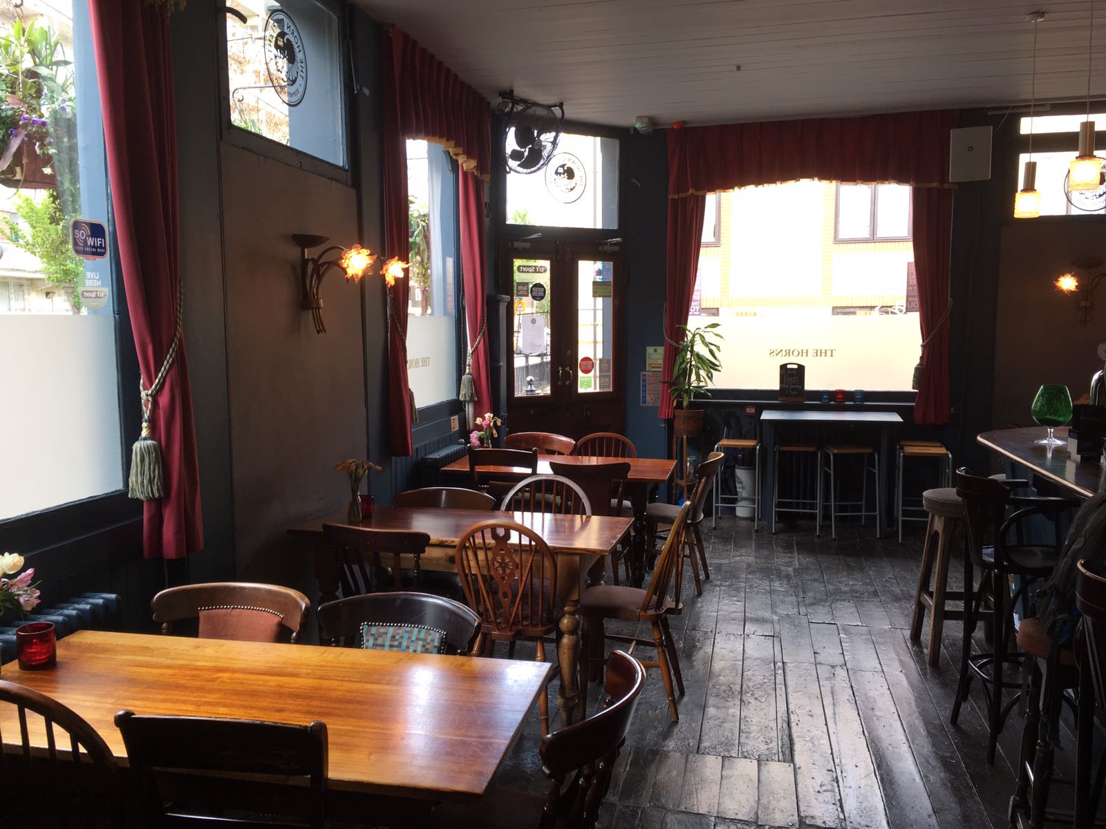 Cozy Whole Pub venue with warm lighting, ideal for casual meetings and events.