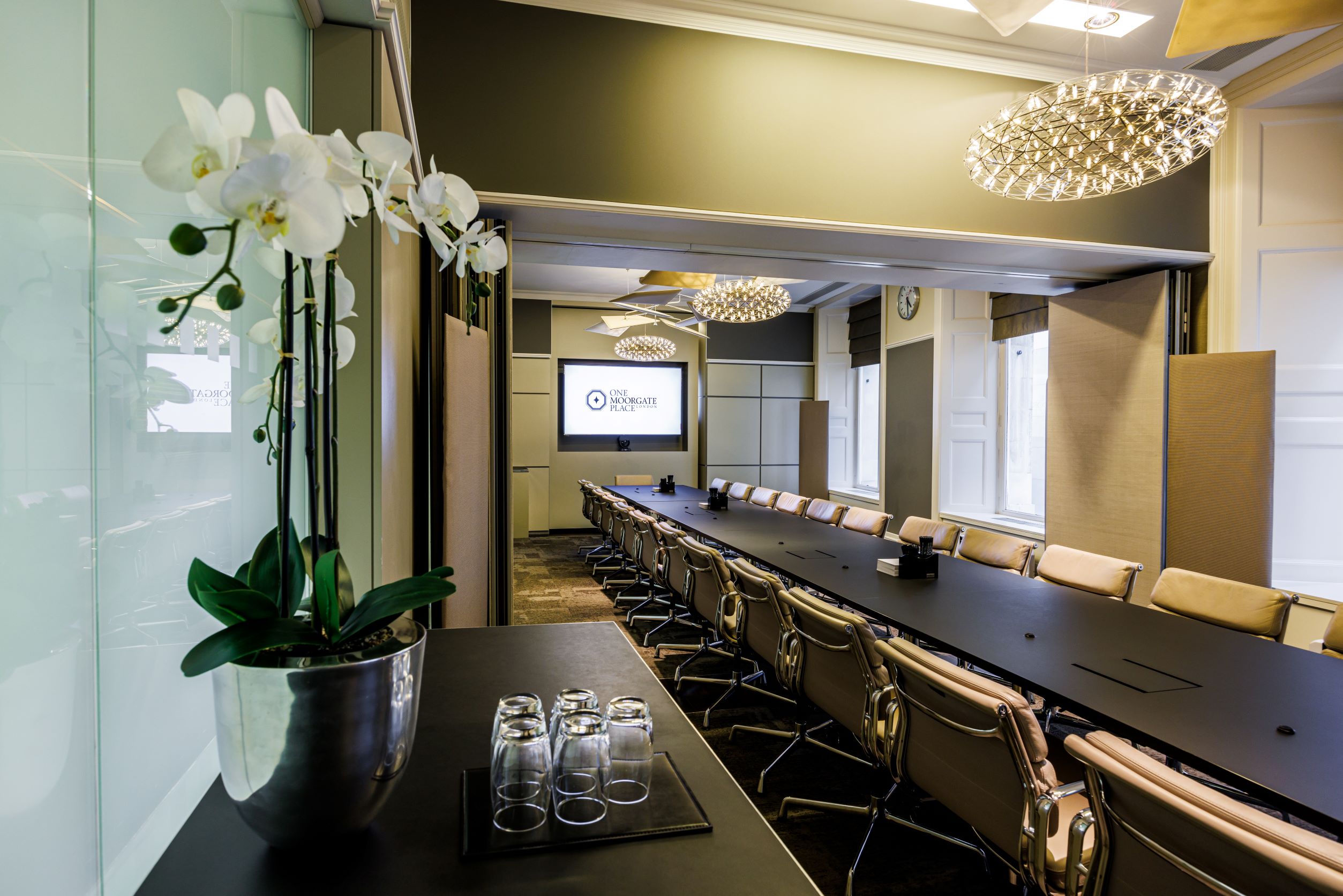Modern conference room at One Moorgate Place with ergonomic chairs and elegant lighting.