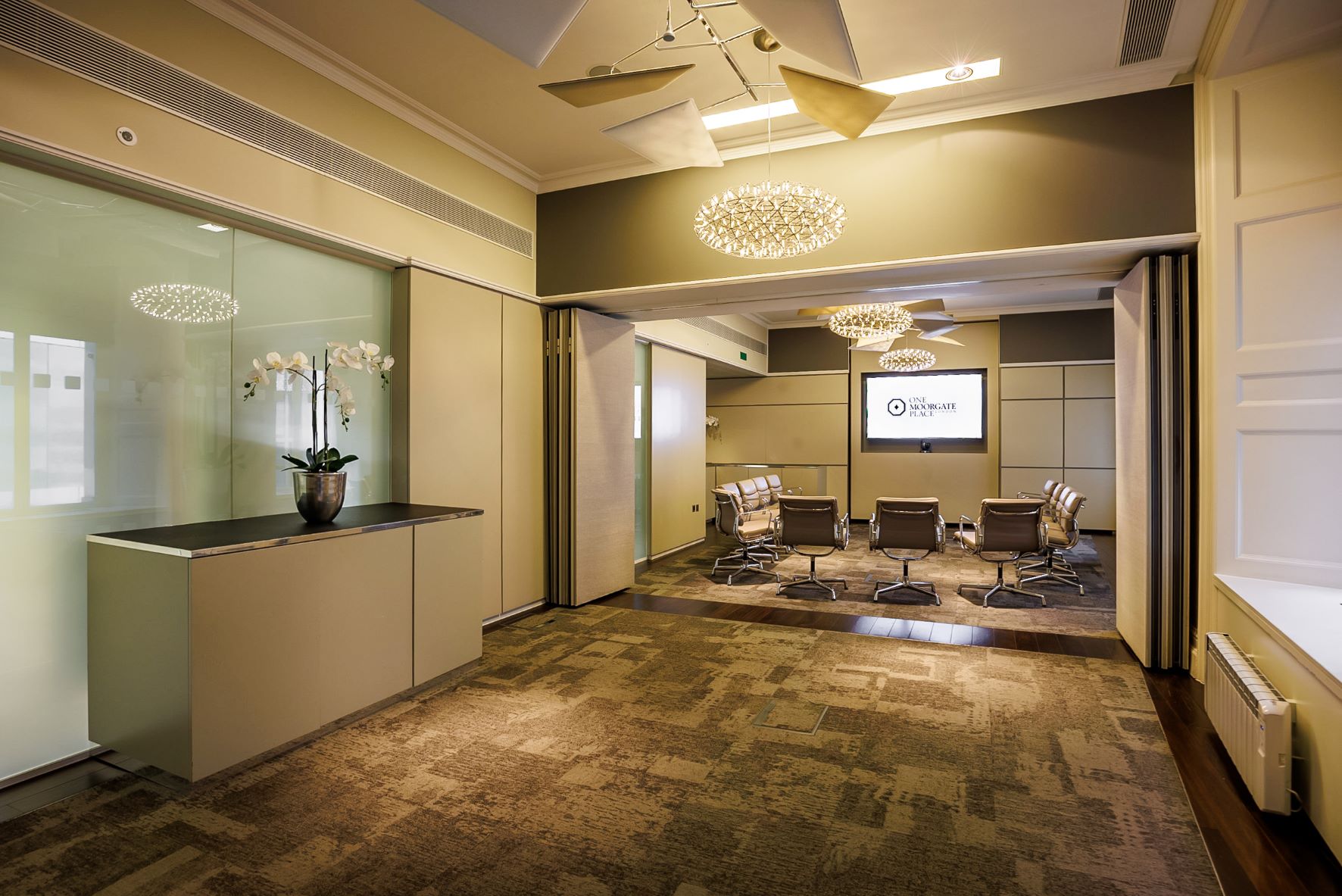 Modern meeting room at One Moorgate Place with sleek furniture for professional events.