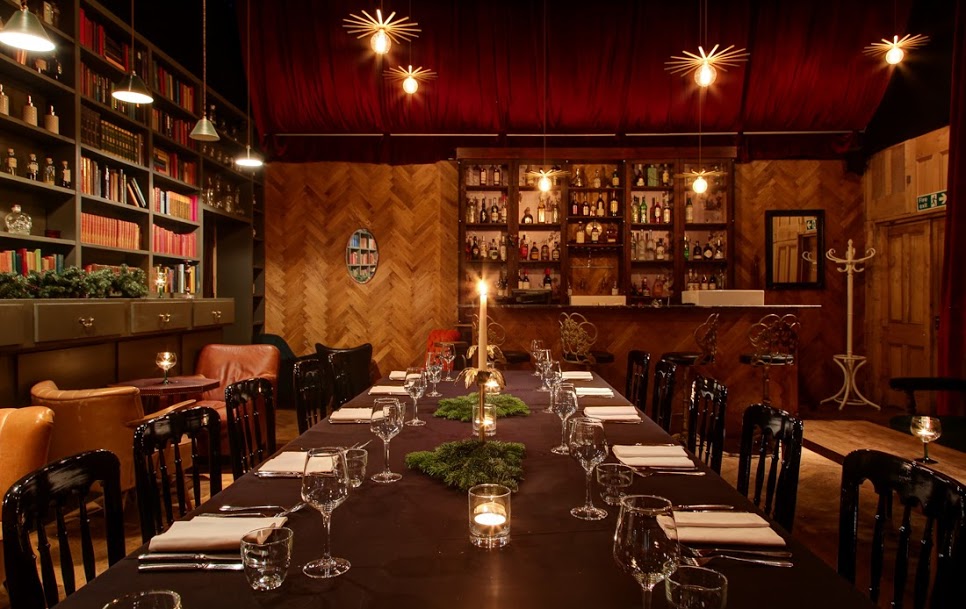 Elegant dining room with long table, perfect for intimate gatherings and corporate dinners.