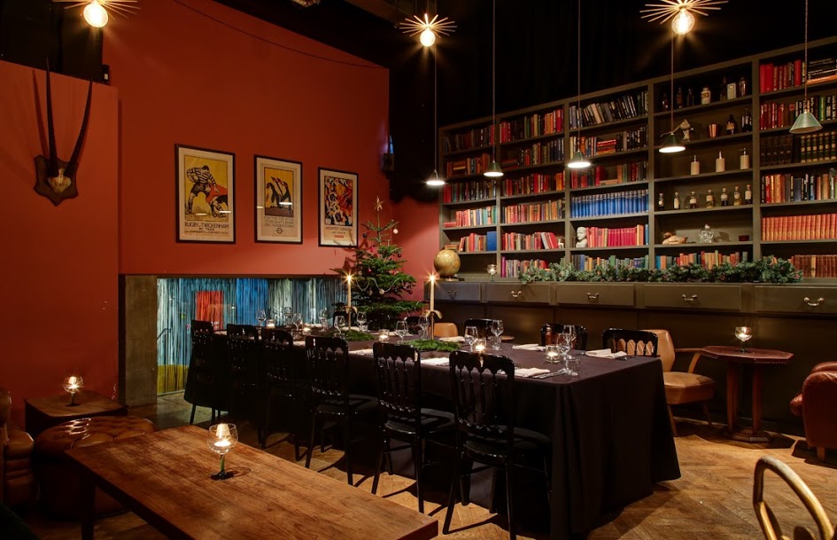 Intimate dining room with long table, perfect for corporate dinners and private events.