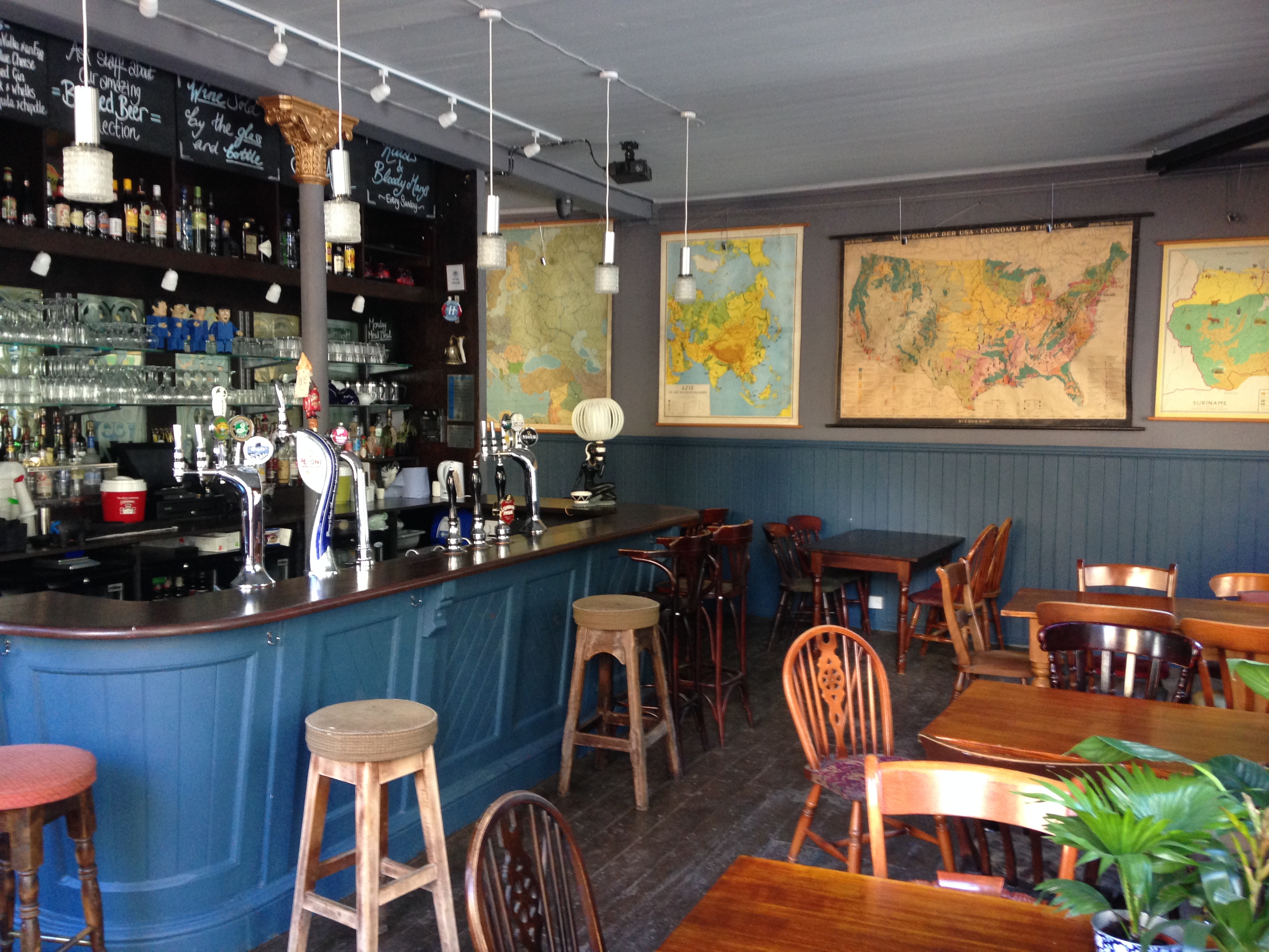 Cozy pub interior with wooden furniture, ideal for networking or casual meetings.
