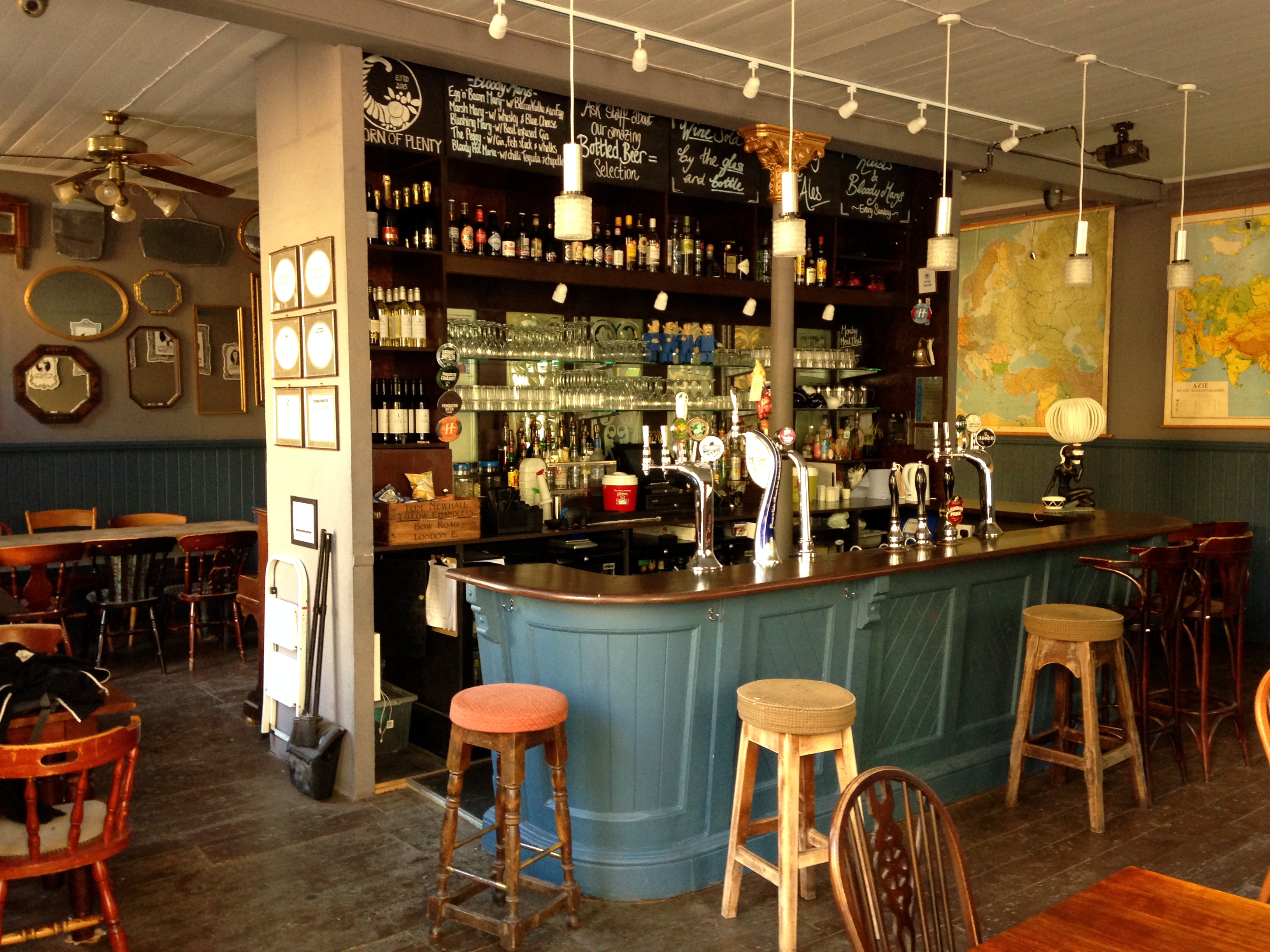 Cozy pub bar setup with warm lighting, perfect for intimate gatherings and networking events.