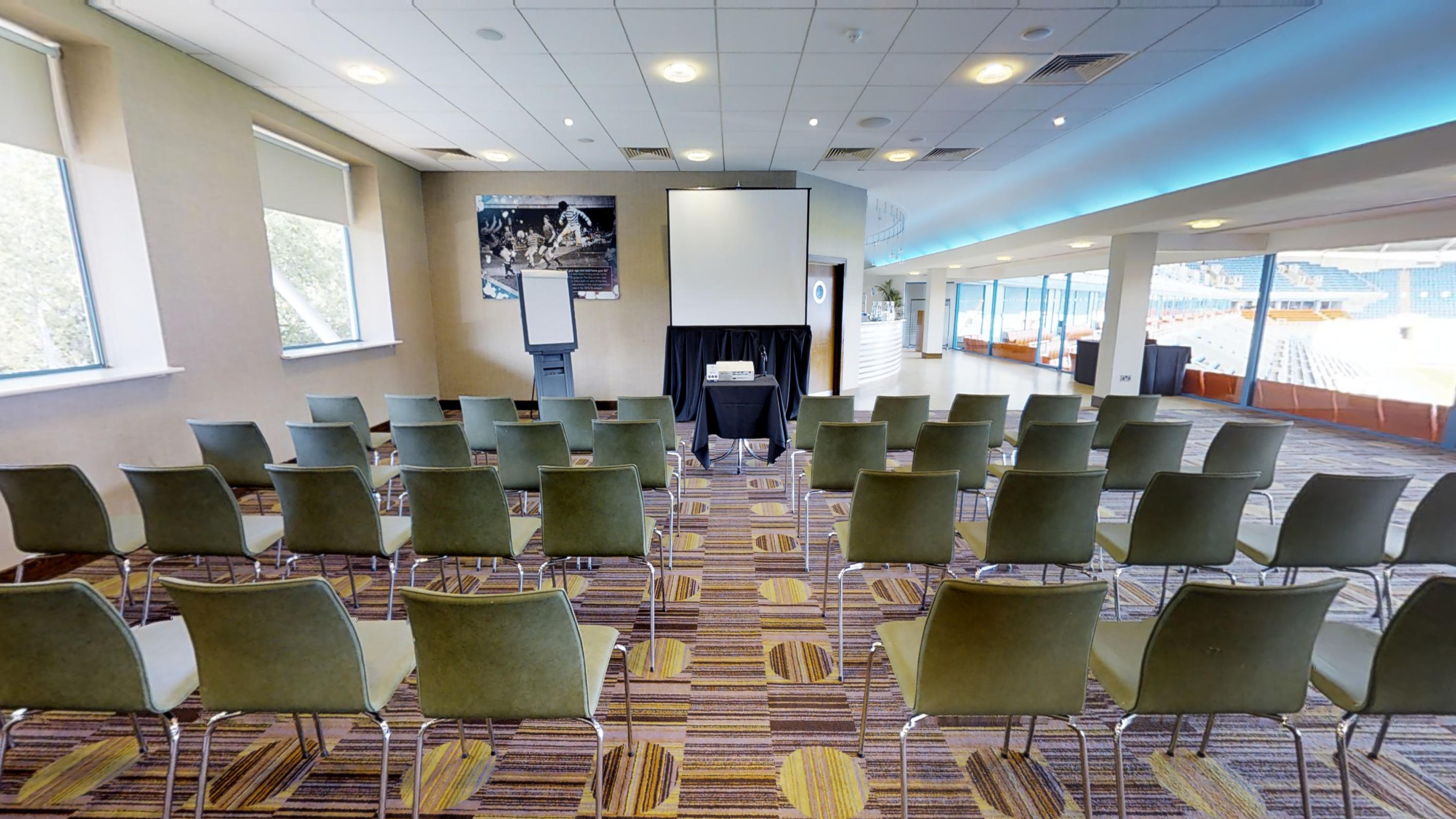 Premier Suite at Reading FC: intimate meeting space with projector for workshops and presentations.