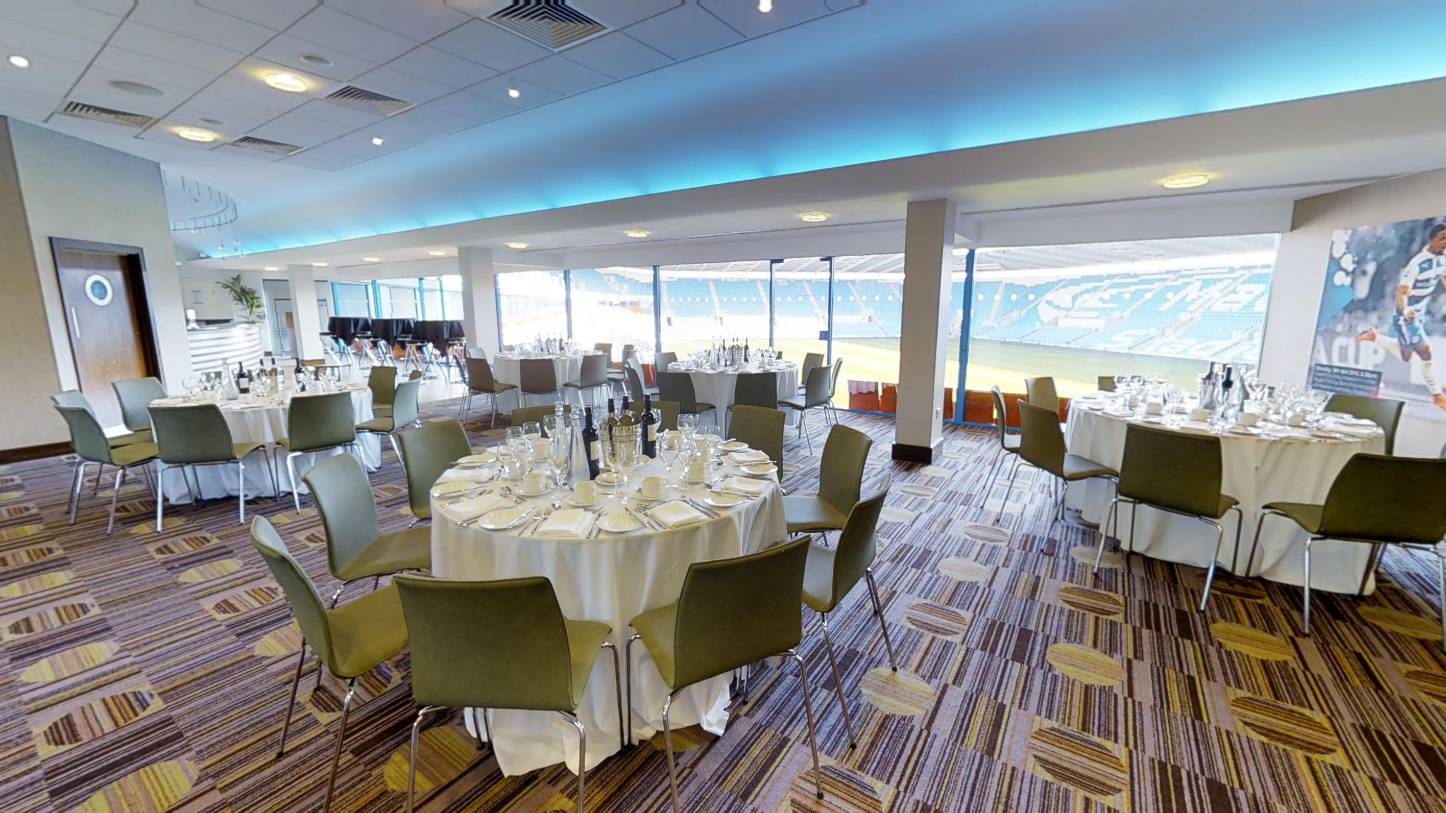 Premier Suite at Reading FC, elegant round tables for corporate events and receptions.