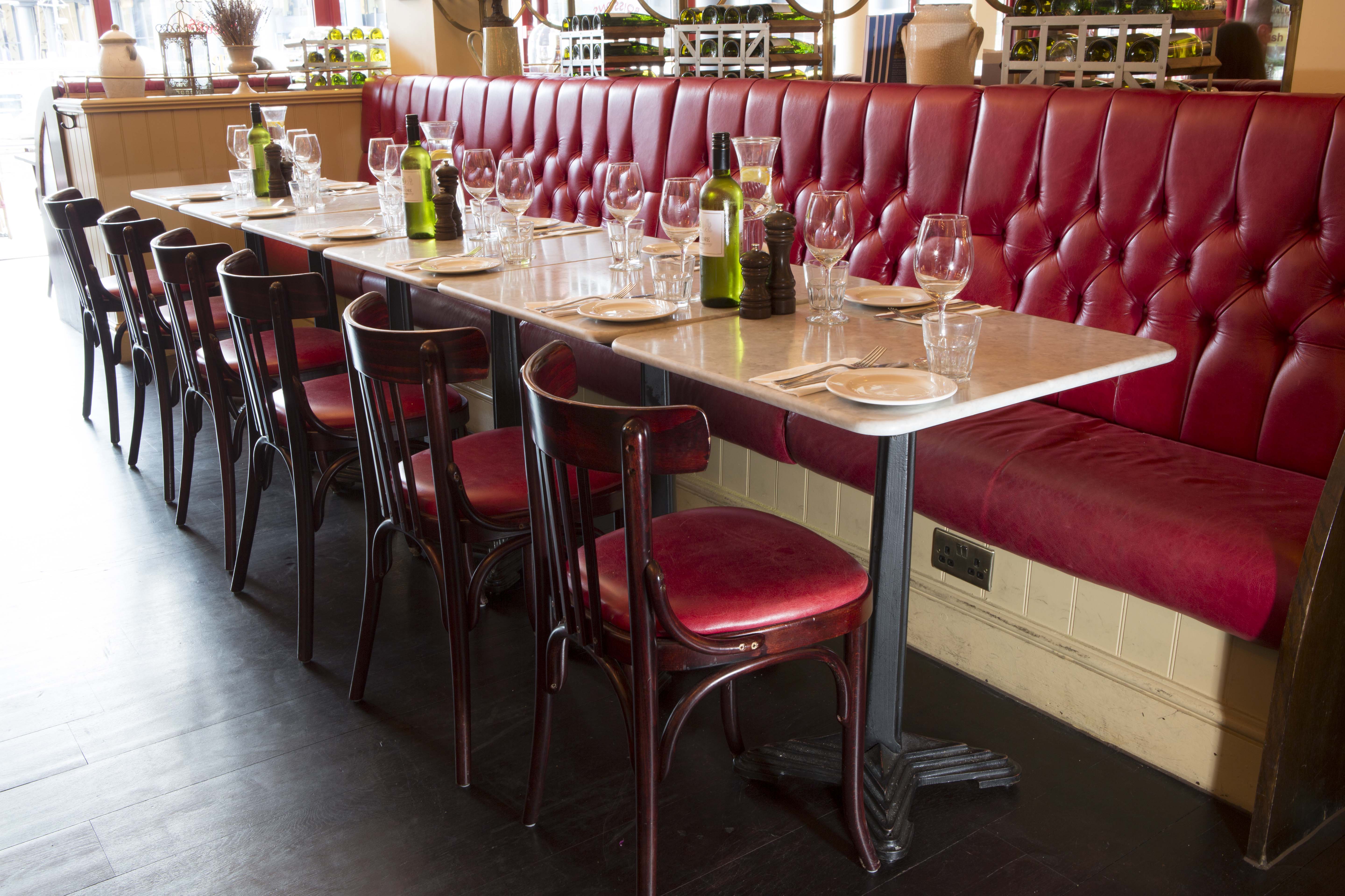 Elegant dining setup at Café Rouge St Katharine Docks for corporate dinners and gatherings.
