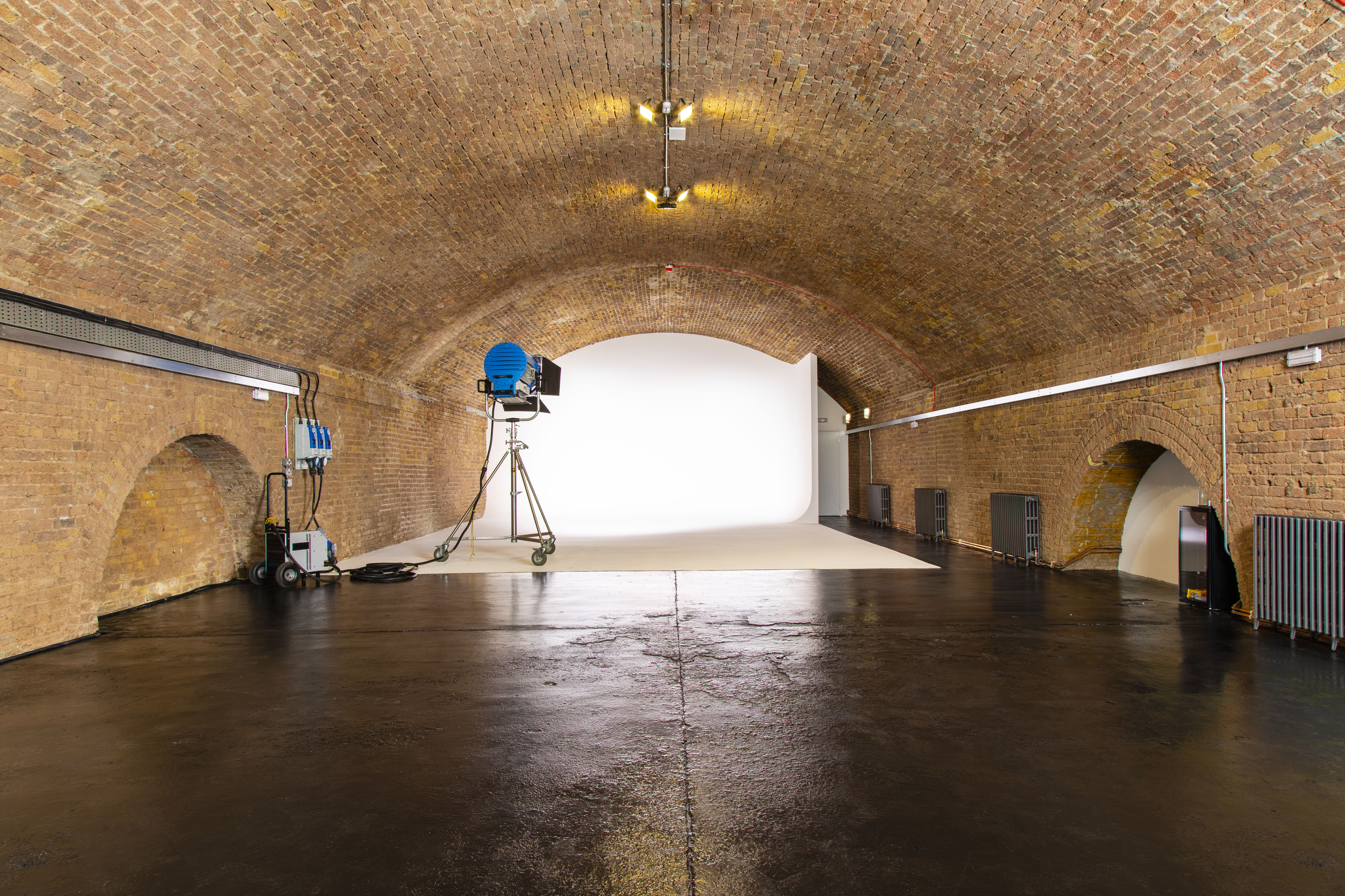 Versatile event space in Rida Haggerston with industrial brick arches for creative events.
