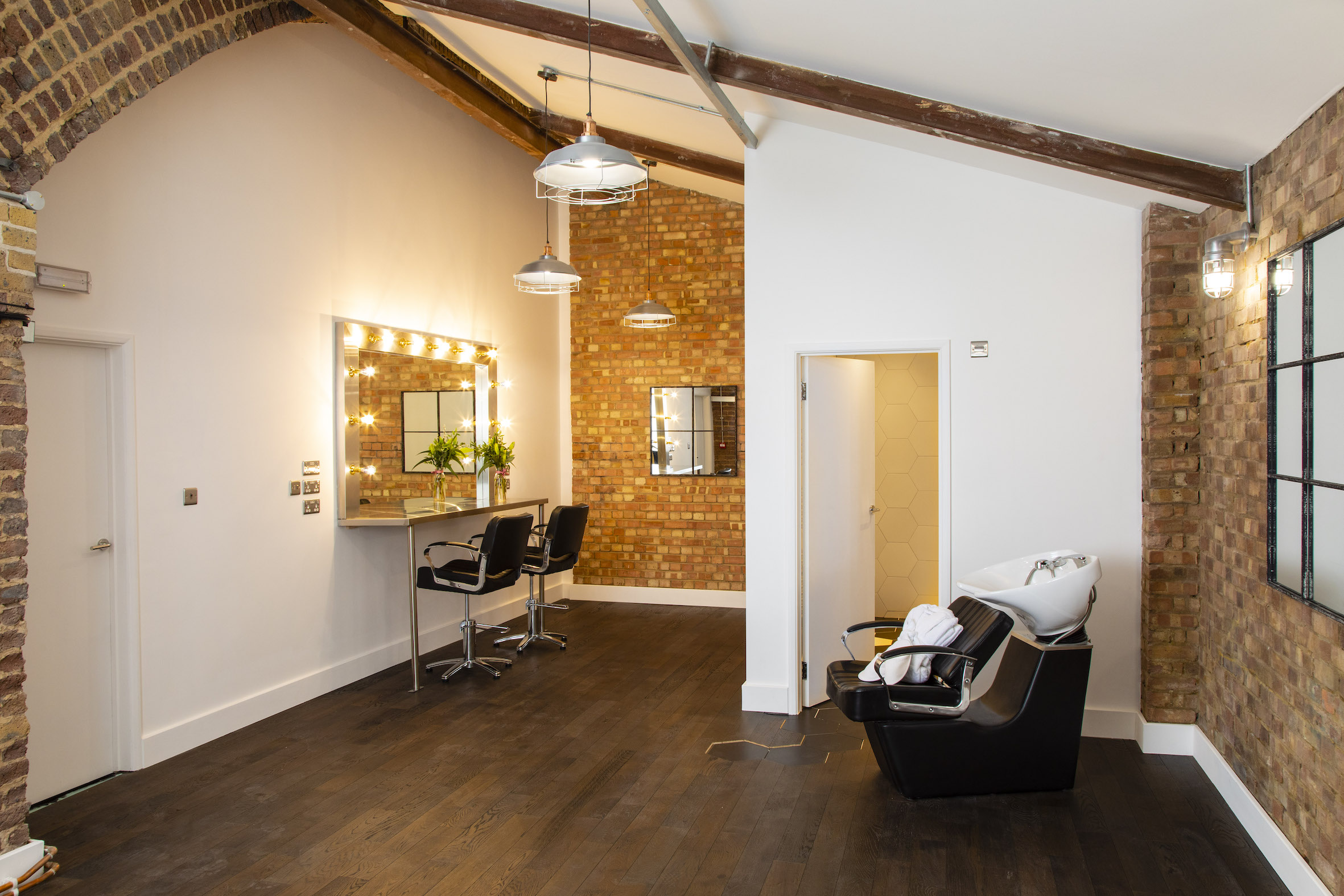 Modern event space in Rida Haggerston with exposed brick for meetings and networking.