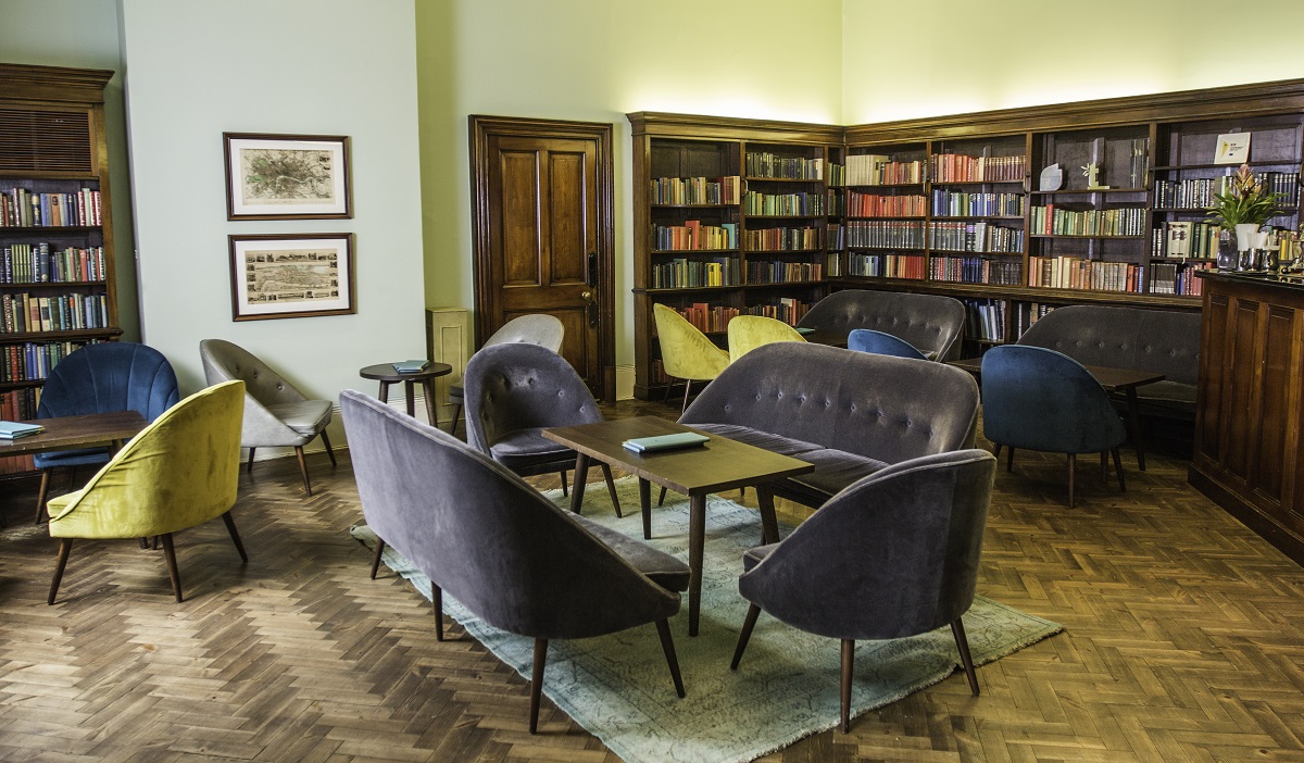 Stylish Library Bar lounge with warm lighting, ideal for networking and book launches.