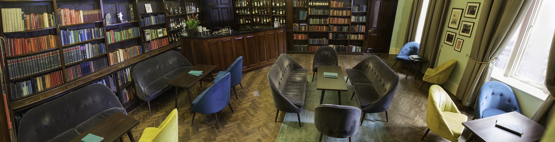 Sophisticated Library Bar lounge with plush seating, ideal for networking events.