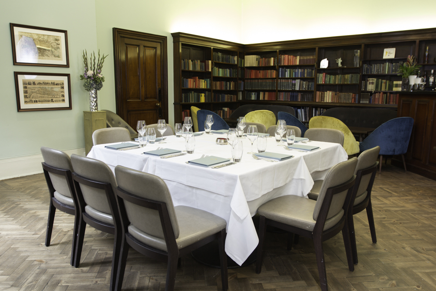 Library Bar at Cinnamon Club: elegant round table, ideal for meetings and private dining.