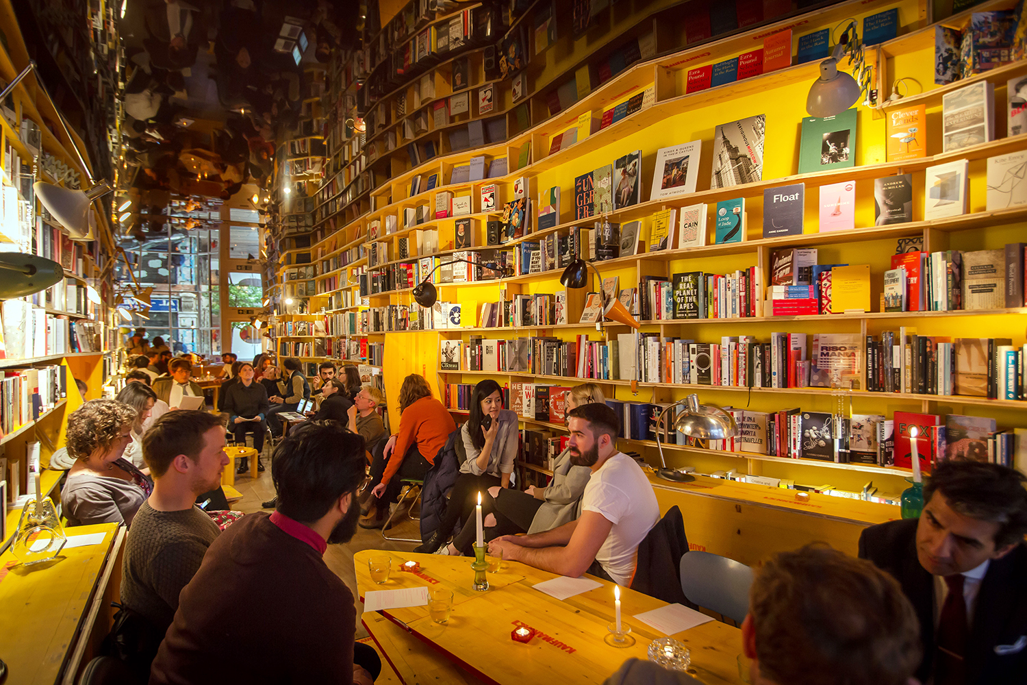 Cozy bookshop venue with warm lighting, ideal for creative events and gatherings.