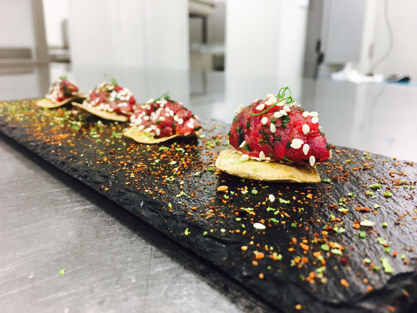 Elegant appetizer presentation on black slate at Coloured Canyon Dining Room, Alexandrie Restaurant.