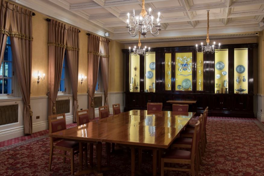 Elegant Livery Hall meeting room with wooden table, ideal for board meetings and events.