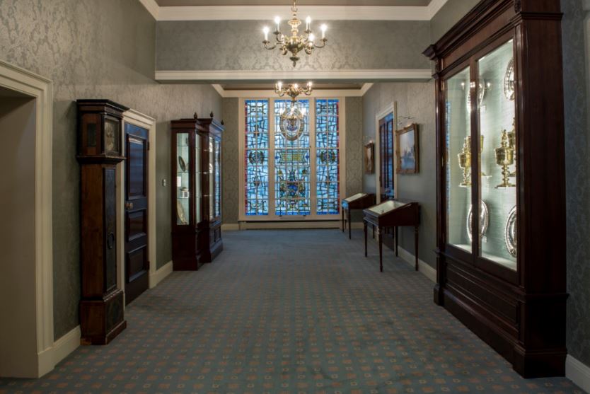Elegant Pewterers' Hall Court Room with stained glass, perfect for upscale events and exhibitions.