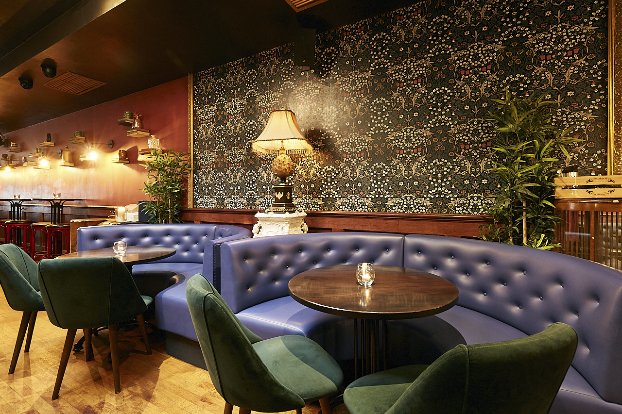 Stylish blue seating area in Back Lounge, ideal for networking events and meetings.