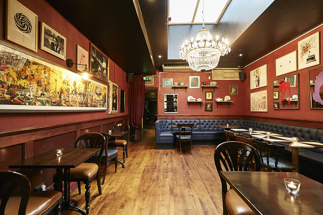 Intimate restaurant venue with elegant chandelier for private events in Little Bat.