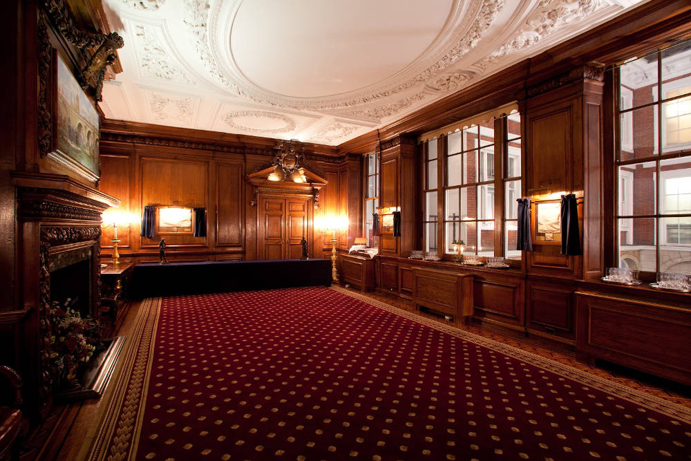 Sophisticated meeting space with wooden paneling for corporate events at Tallow Chandlers' Hall.