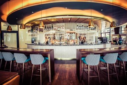 Modern bar area in Rotunda Restaurant, ideal for networking events and casual meetings.