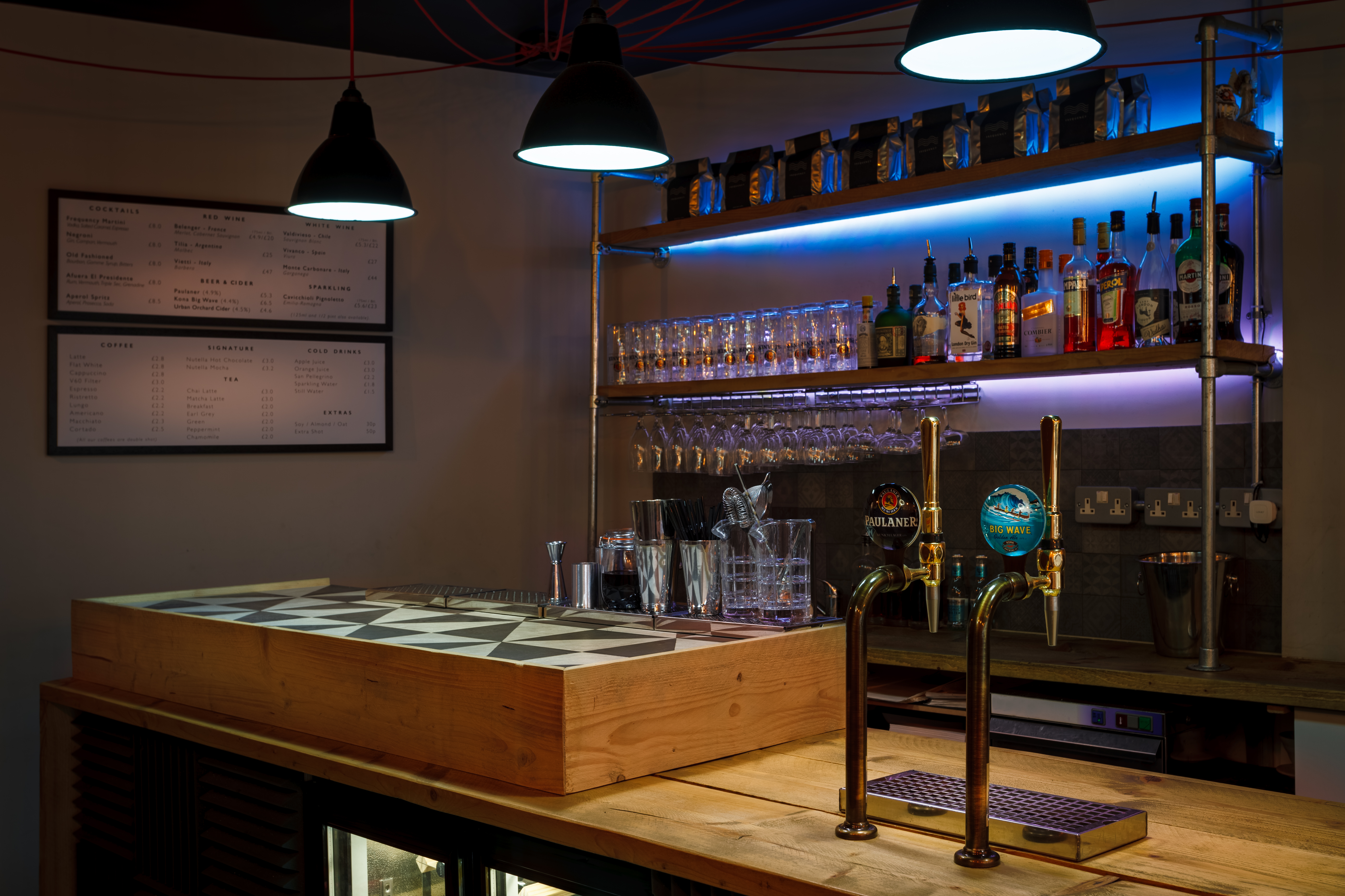 Sleek bar area in Frequency Cafe, perfect for networking events and social gatherings.