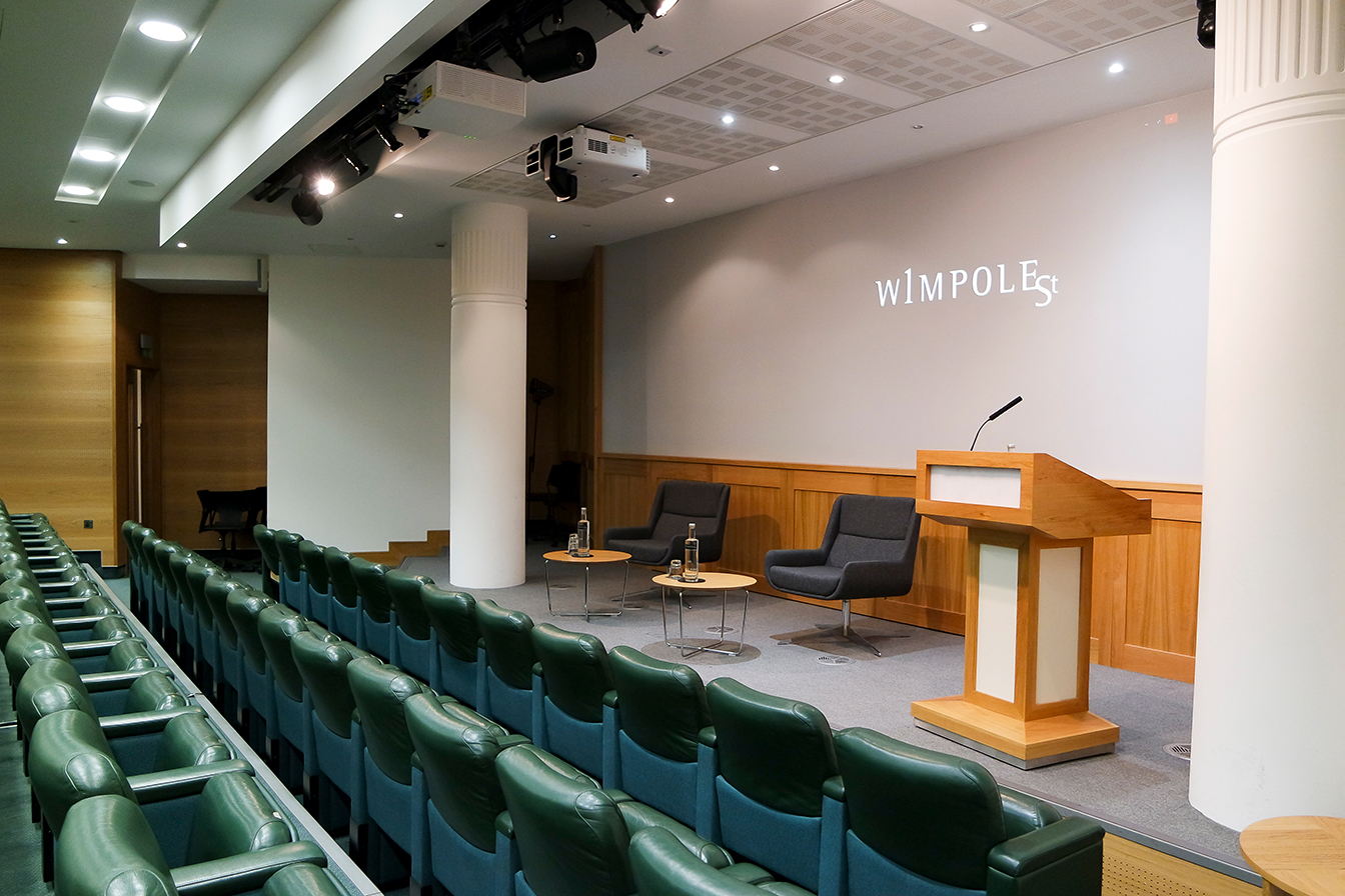 Max Rayne Auditorium with podium and seating, ideal for presentations and panel discussions.