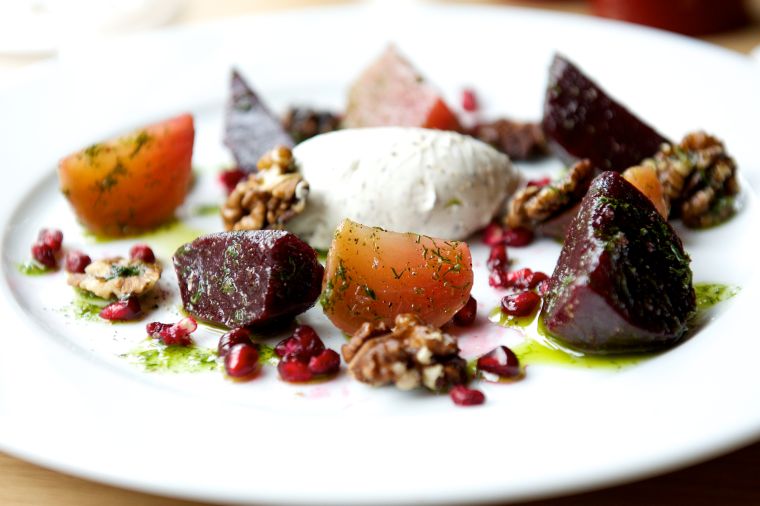 Vibrant beet dish with herbs and cheese for elegant catered events and meetings.