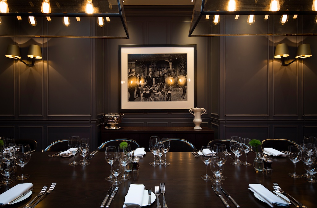 Private dining room at The London EDITION, elegantly set for upscale events and meetings.