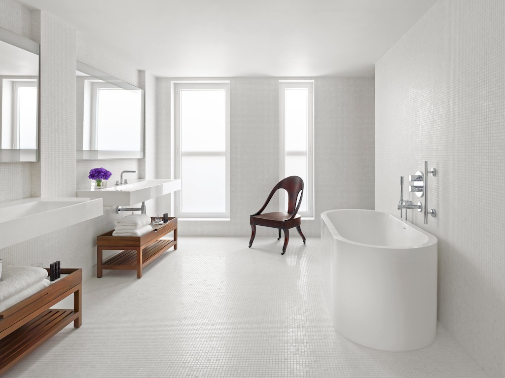 Luxurious penthouse bathroom at The London EDITION, ideal for events and wellness breaks.