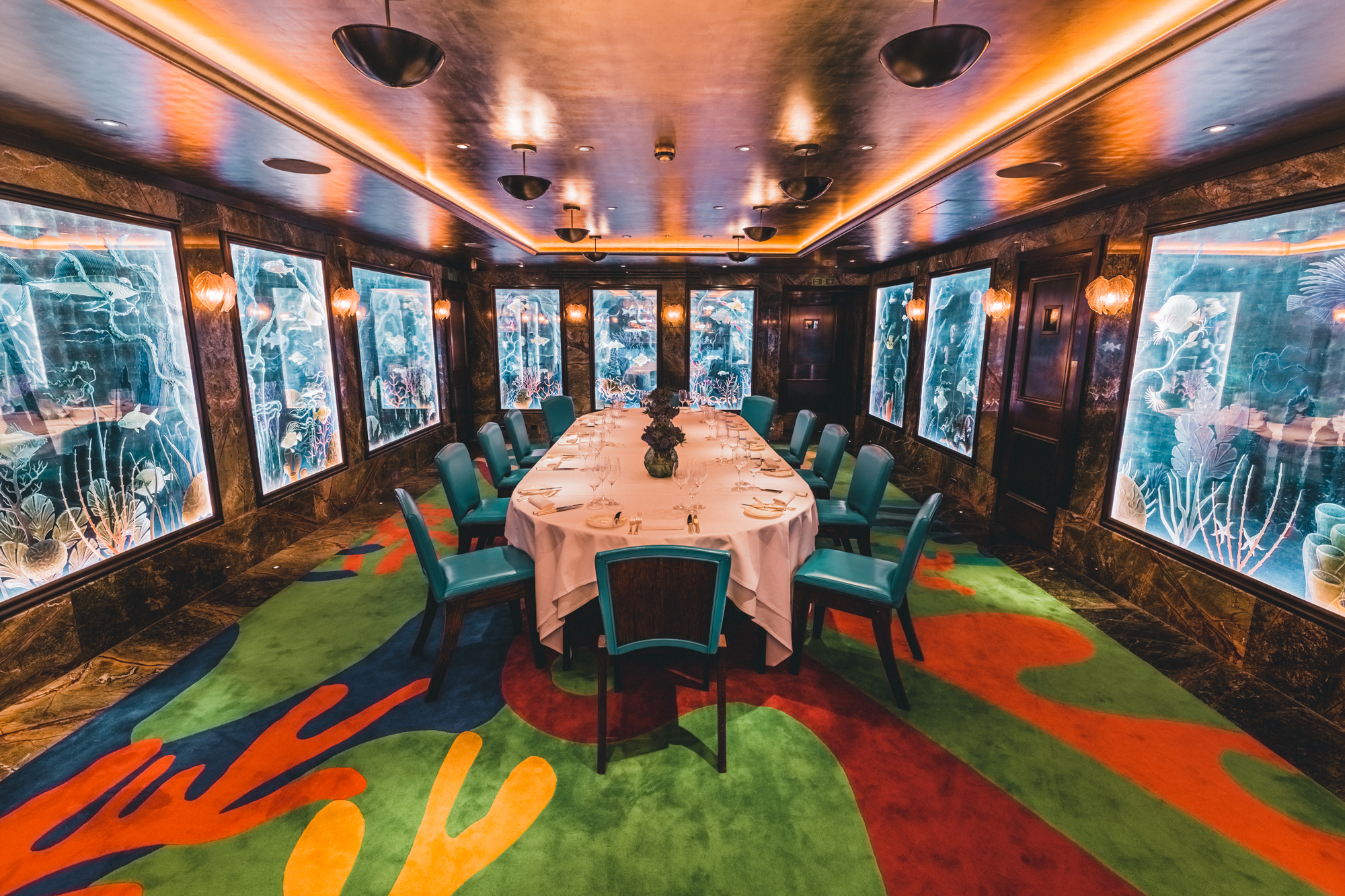 Elegant meeting space with blue chairs, ideal for corporate events and gatherings.