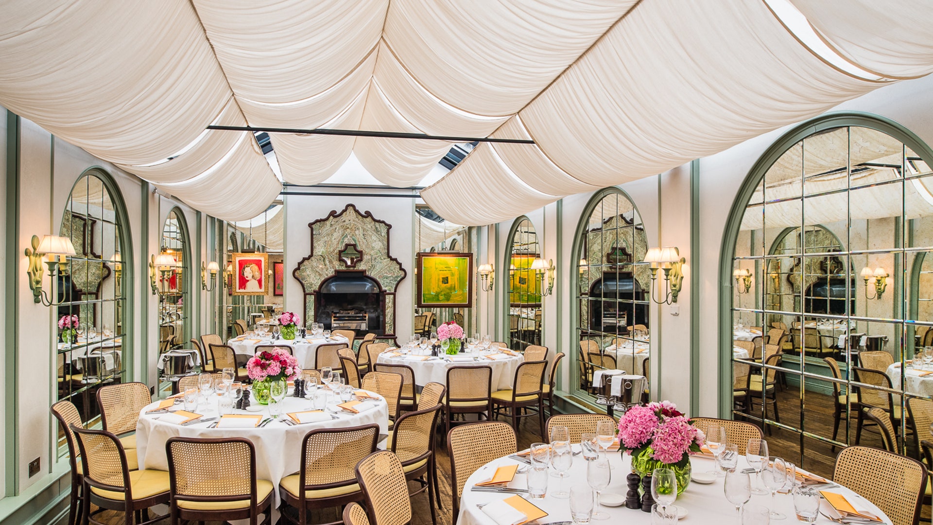 Elegant event space at The Conservatory with floral centerpieces for upscale gatherings.