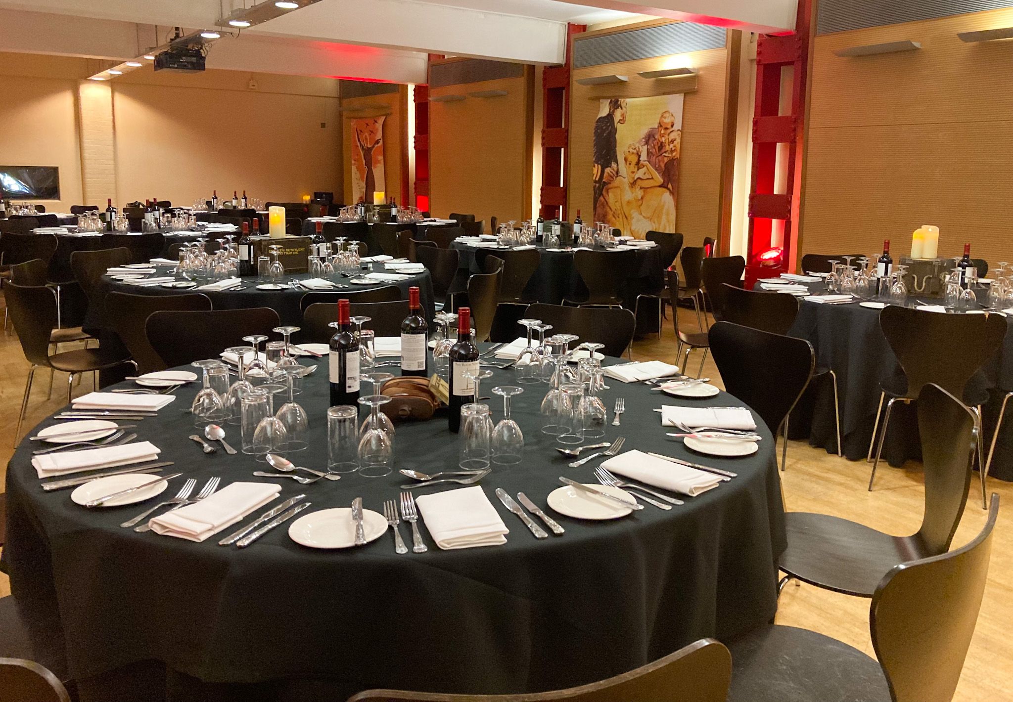 HCA Auditorium event space with elegant round tables for fine dining and social gatherings.