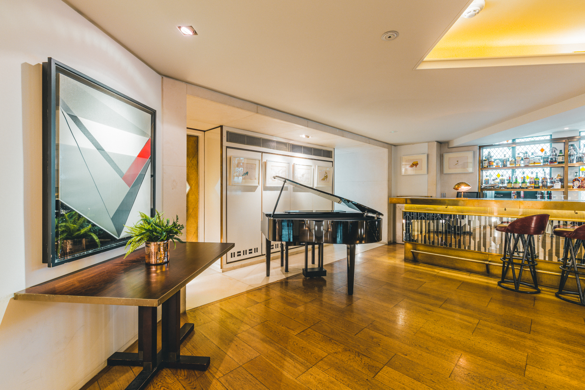 Sophisticated Ivy Club Loft with grand piano, ideal for cocktail receptions and gatherings.